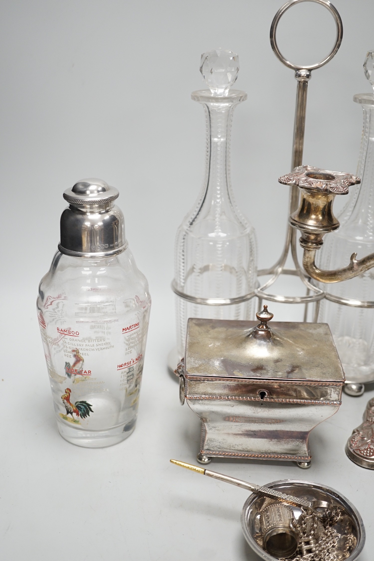 Assorted plated items including a decanter stand with two bottles, by Hukin & Heath and a tea caddy etc.